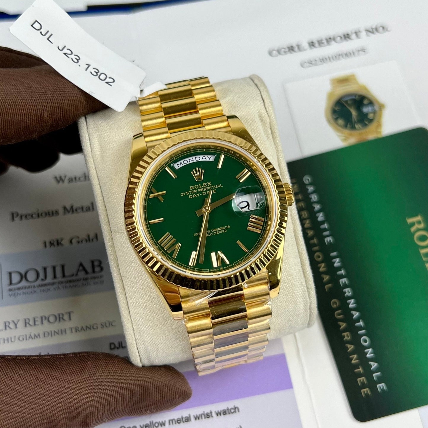 Rolex DayDate 40 mm 228238 enduit or jaune 18 carats cadran vert président 130 grammes